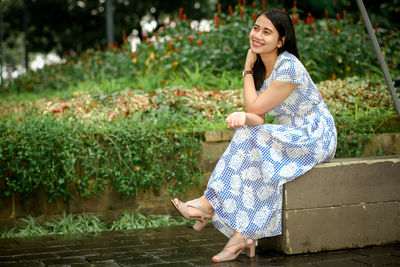 Young woman sitting outdoors