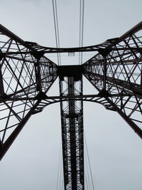 Low angle view of rollercoaster against sky