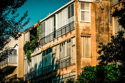 Low angle view of old building against blue sky
