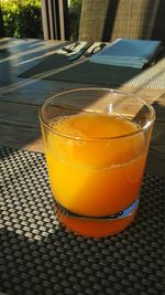 Close-up of orange juice on table