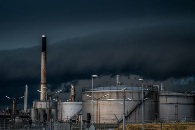 Storm clouds over crossbridge energy fredericia refinery, denmark