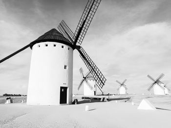 Low angle view of traditional windmill against sky