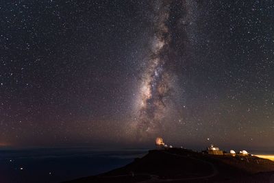 Scenic view of star field against sky at night