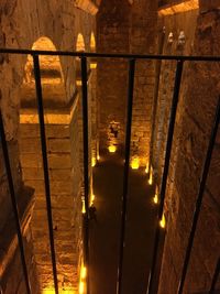 High angle view of illuminated street lights on building