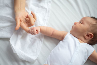 Cute baby lying on bed