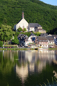 Moselle river against buildings and mountain