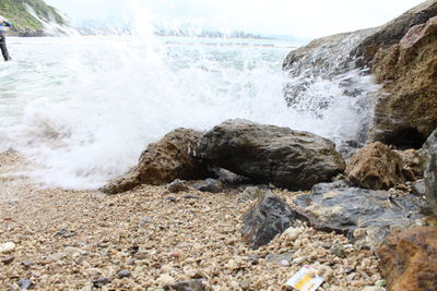 Waves splashing on rocks at shore