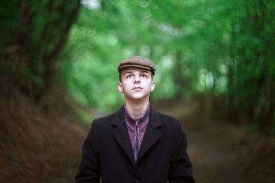 Portrait of young man standing outdoors