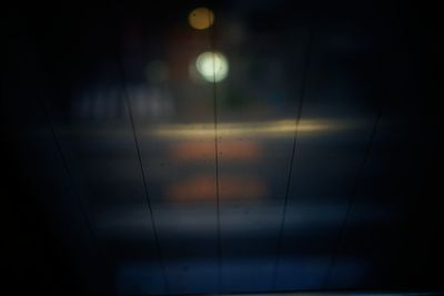 Low angle view of illuminated lights at night