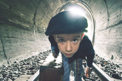 Portrait of boy against wall