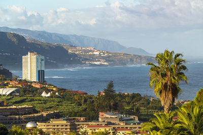 Puerto de la cruz panoramic view by parque taoro with mountains