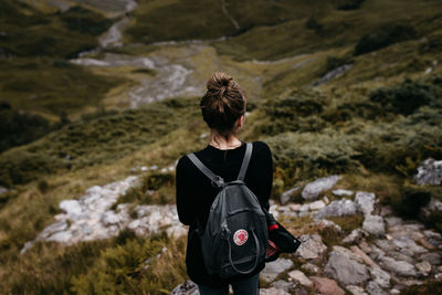 Rear view of man climbing on mountain