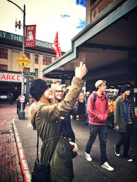 People standing on street in city