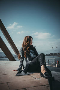 Woman sitting outdoors