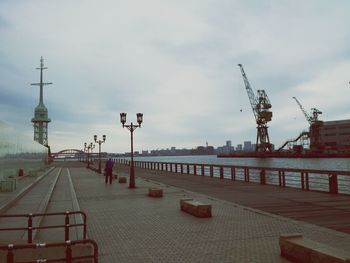 City street against cloudy sky