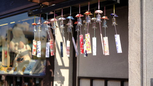 Decorations hanging in market stall for sale