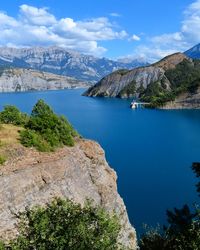 Scenic view of mountains and sea against sky