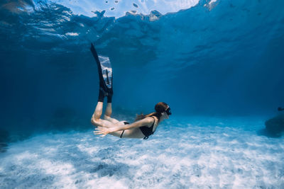 Woman swimming in sea