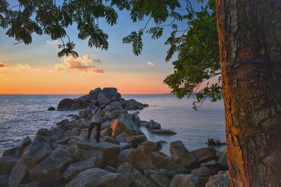 Scenic view of sea against sky during sunset