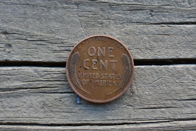 Close-up of information sign on wooden door