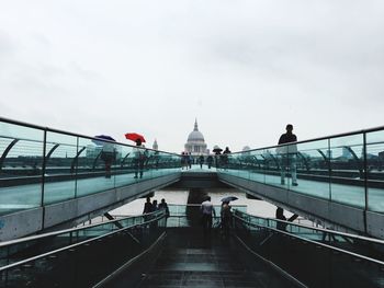 People walking on footbridge