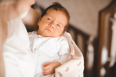 Close-up of cute girl looking away