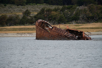 Abandoned boat on shore