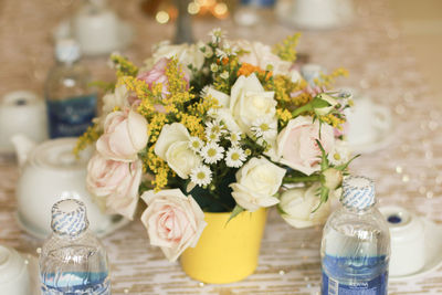 Close-up of roses in vase on table
