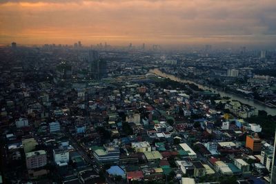 Aerial view of illuminated cityscape at night