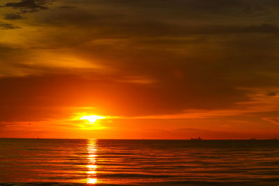 Scenic view of sea against romantic sky at sunset