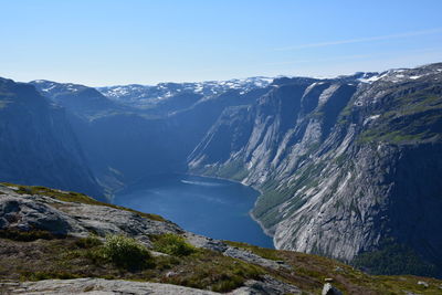 Scenic view of mountains against clear blue sky