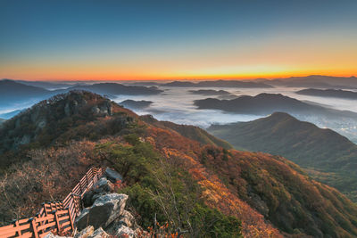 High angle view of mountains against sky during sunset