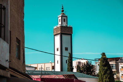 Low angle view of buildings against blue sky