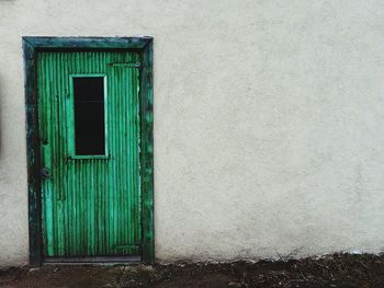 Green closed door of old house