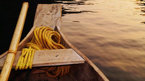 High angle view of rope tied on wooden post