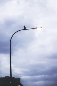 Low angle view of street light against sky