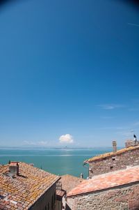 Scenic view of sea against blue sky