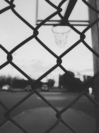 Full frame shot of chainlink fence against sky