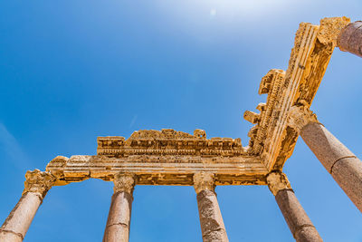 Low angle view of old ruins against sky