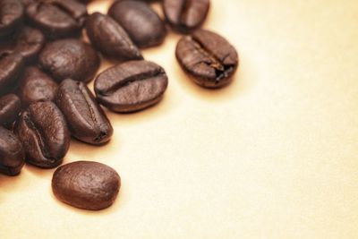 Close-up of coffee beans on table