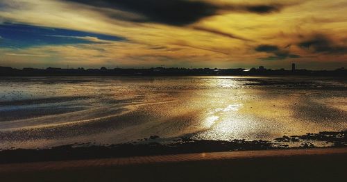 Scenic view of sea against dramatic sky