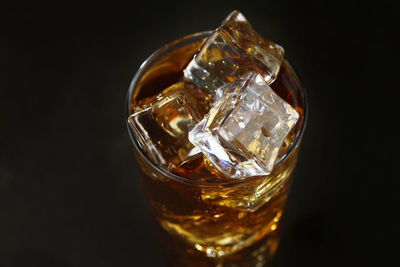 Close-up of ice cubes against black background