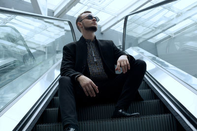 Portrait of businessman standing in office