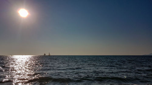 Scenic view of sea against clear sky during sunset