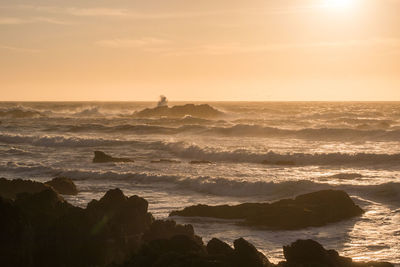 Scenic view of sea against sky during sunset