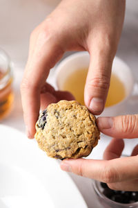 Close-up of hand holding cookies