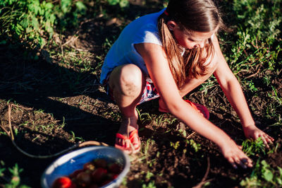 Girl planting in garden