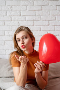 Celebration of valentine's day, wedding and love day, women's day.beautiful woman holding red heart