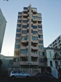 Cars on road against buildings