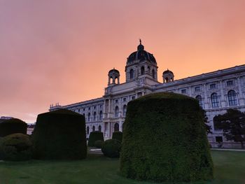 Low angle view of building against sky during sunset